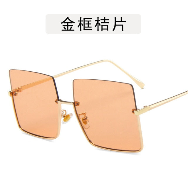 Lunettes de soleil femme demi-monture métal garni